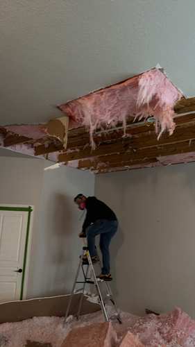 Flood Titan Restoration IICRC certified technician performing ceiling water damage restoration in Southlake Texas area home